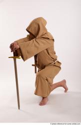 JOEL_ADAMSON MONK KNEELING POSE WITH SWORD